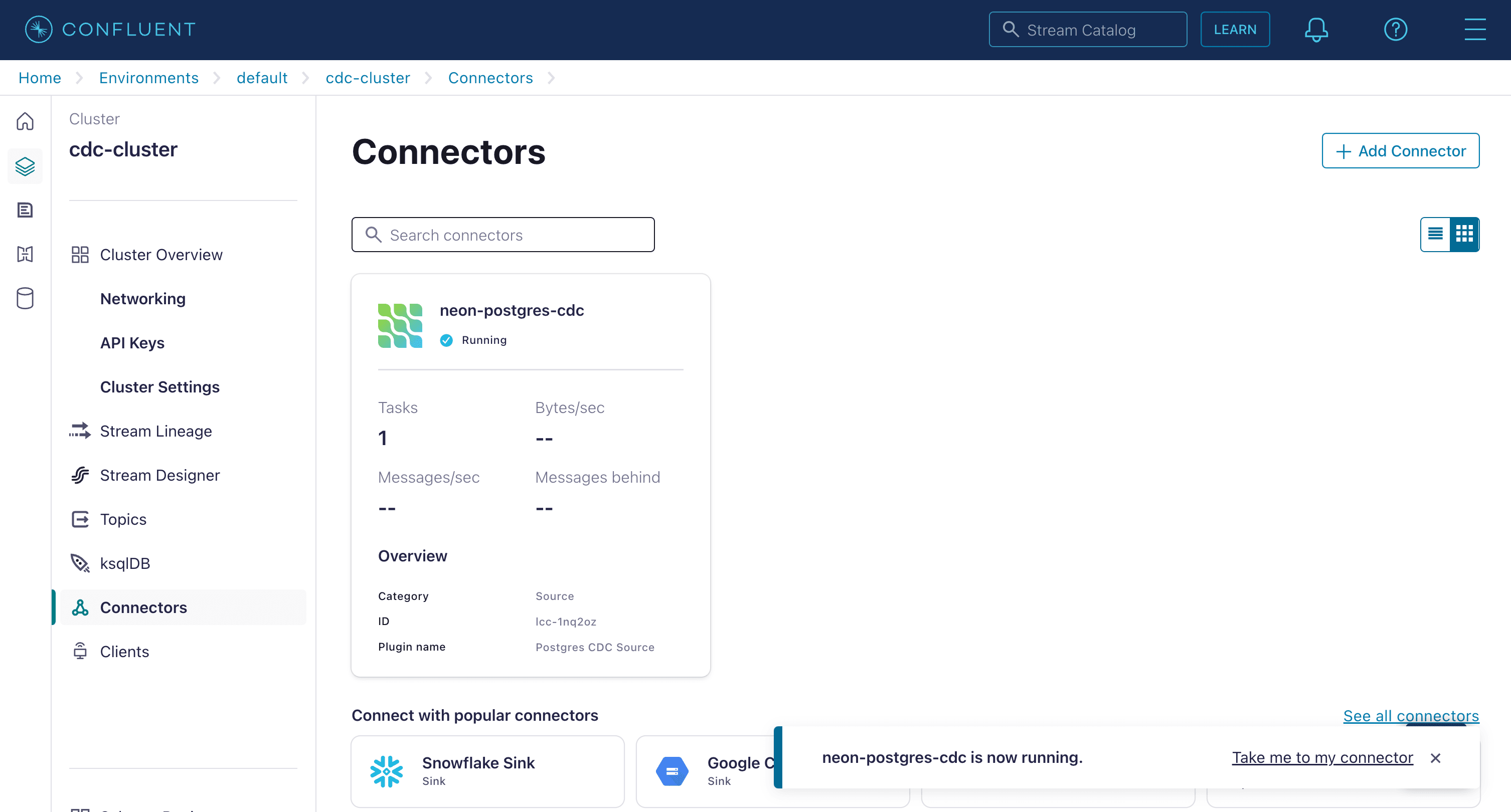 Confluent Cloud dashboard showing the Postgres CDC Source connector deployed and running.